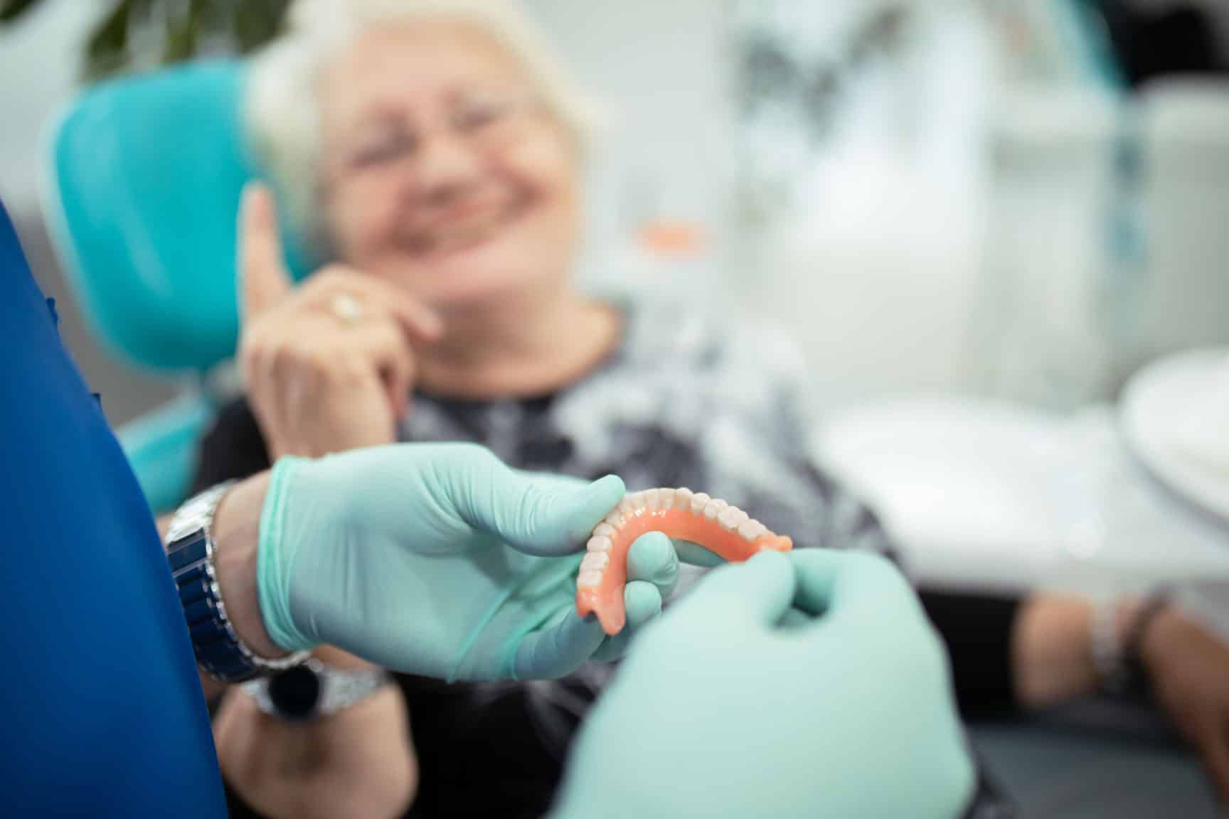 Patient receiving complete dentures