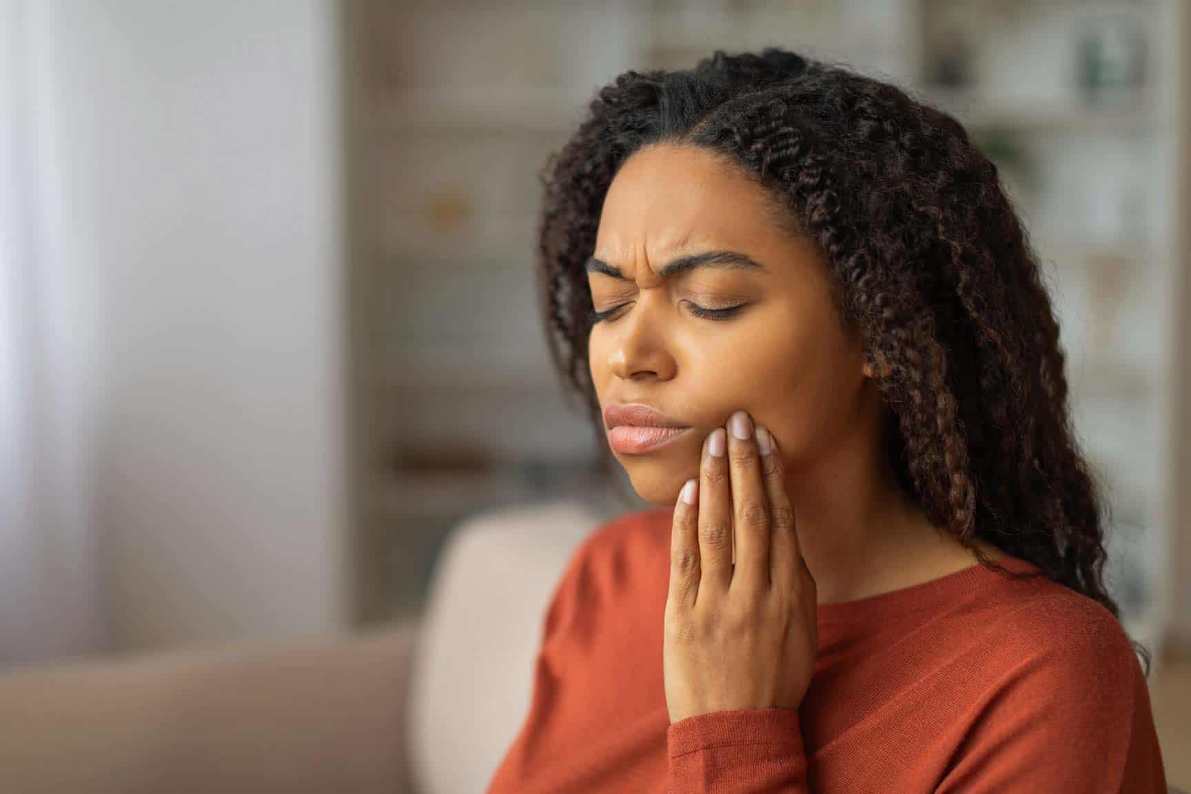 Woman experiencing tooth pain