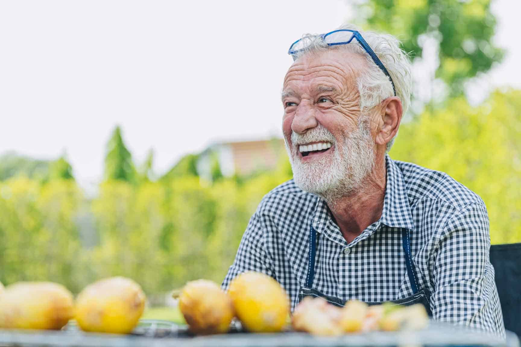 Smiling man with fresh fruit