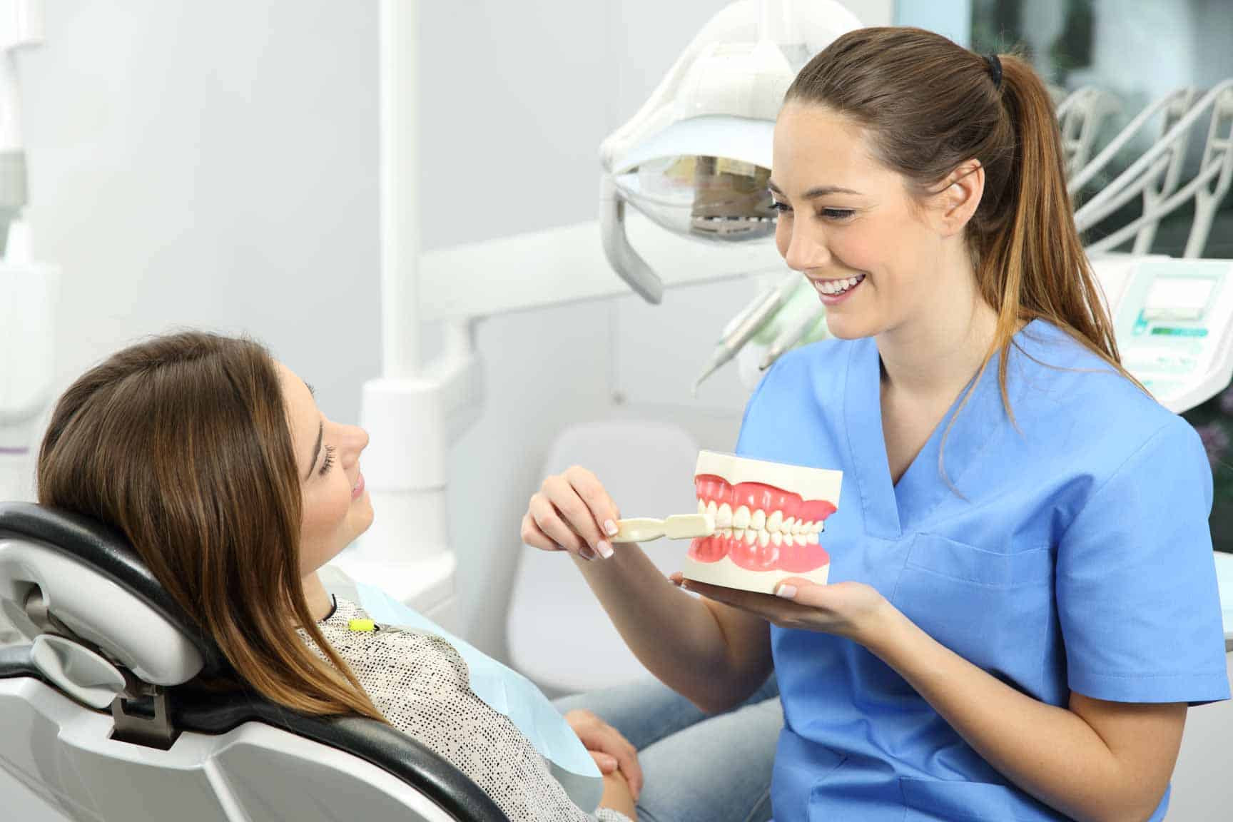 Dental hygienist speaking with a patient